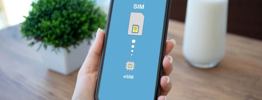 An esim canada card on a phone held by a woman's hand